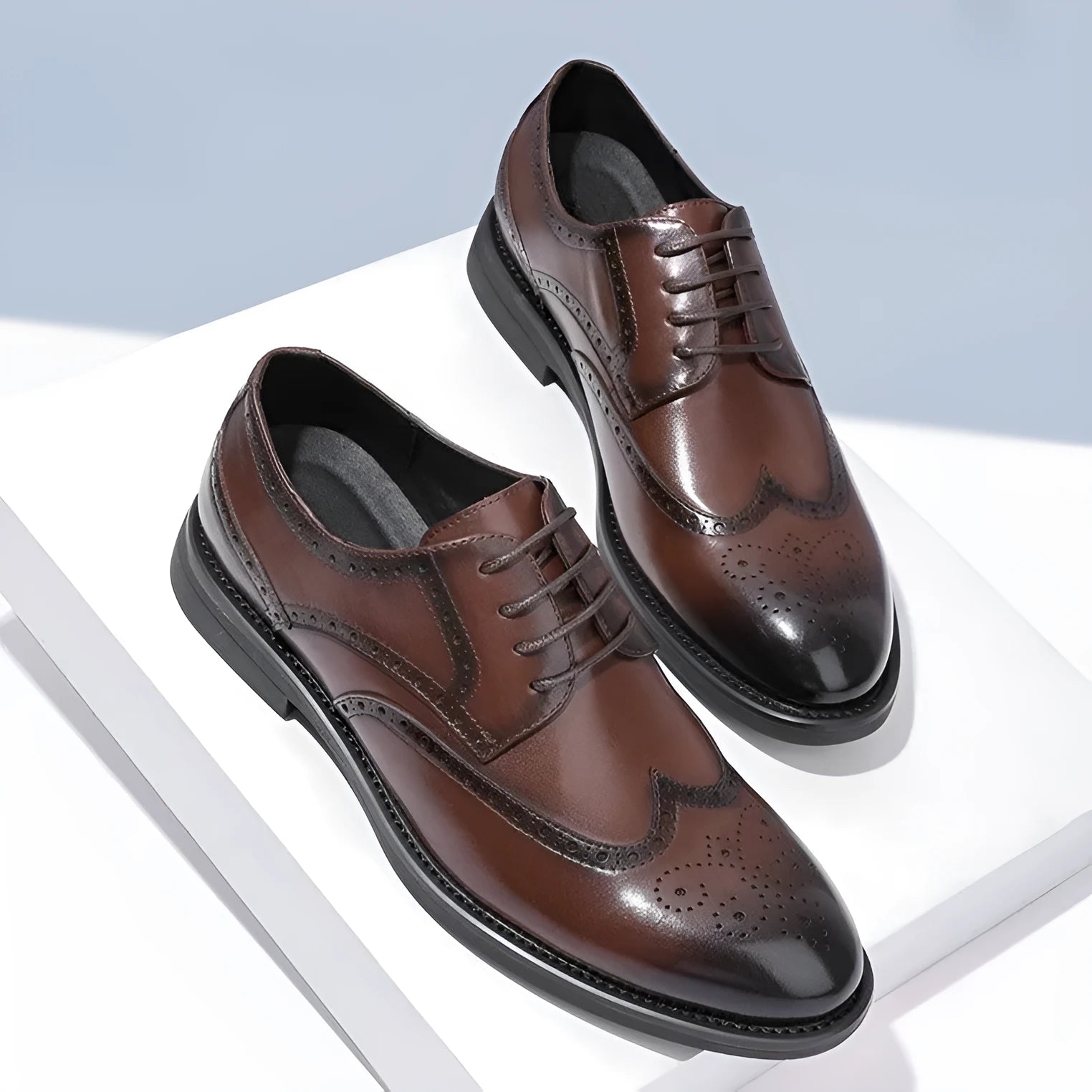 A pair of men's classic black brogue business shoes with a PU leather upper.