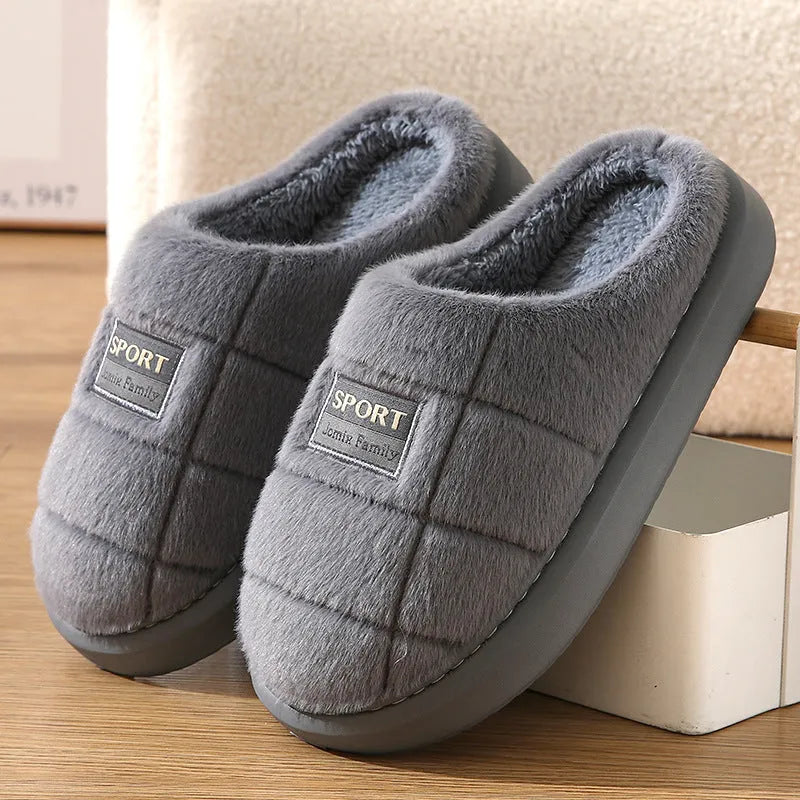 Men's grey plaid winter slippers with thick sole and rabbit hair upper.