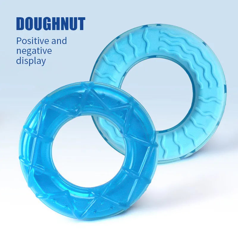Set of four water-filled dog cooling toys in pacifier, popsicle, and ring shapes on a blue background.