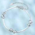 Sterling silver bow bracelet with romantic fairy style on white background