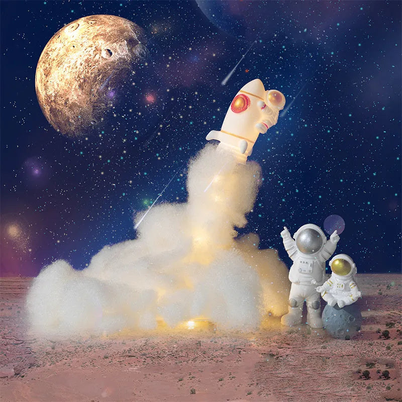 DIY astronaut rocket LED night light kit with battery and USB options, showing model parts and warm glow.
