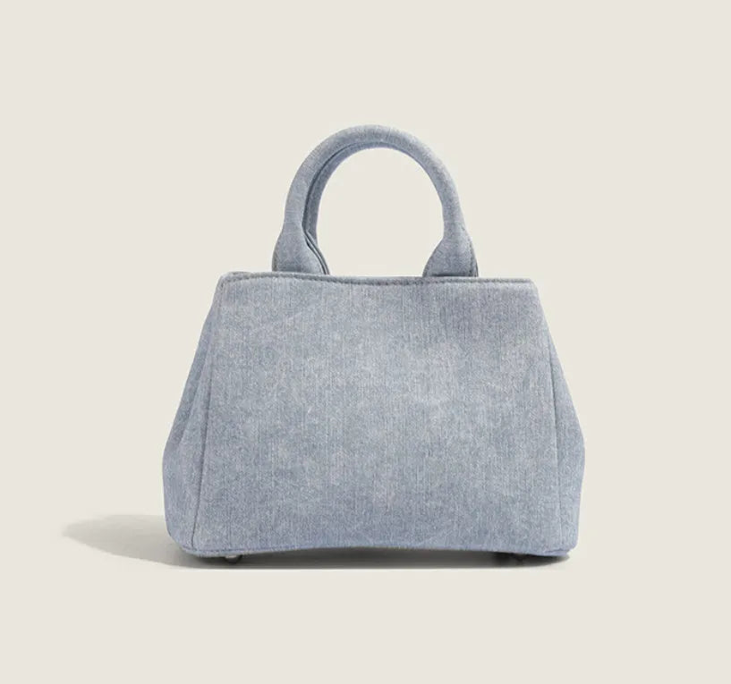 Women's denim shoulder bag in casual style with soft PU construction and polyester lining