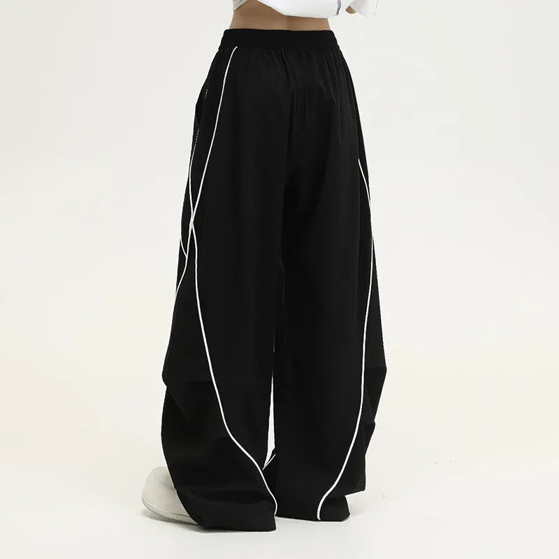 Black striped hip hop trousers with pleated wide-leg design for dance and casual wear