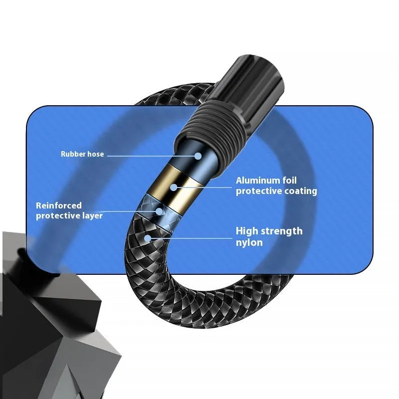 Black portable 12V tyre inflator with digital display and power cable on a garage floor