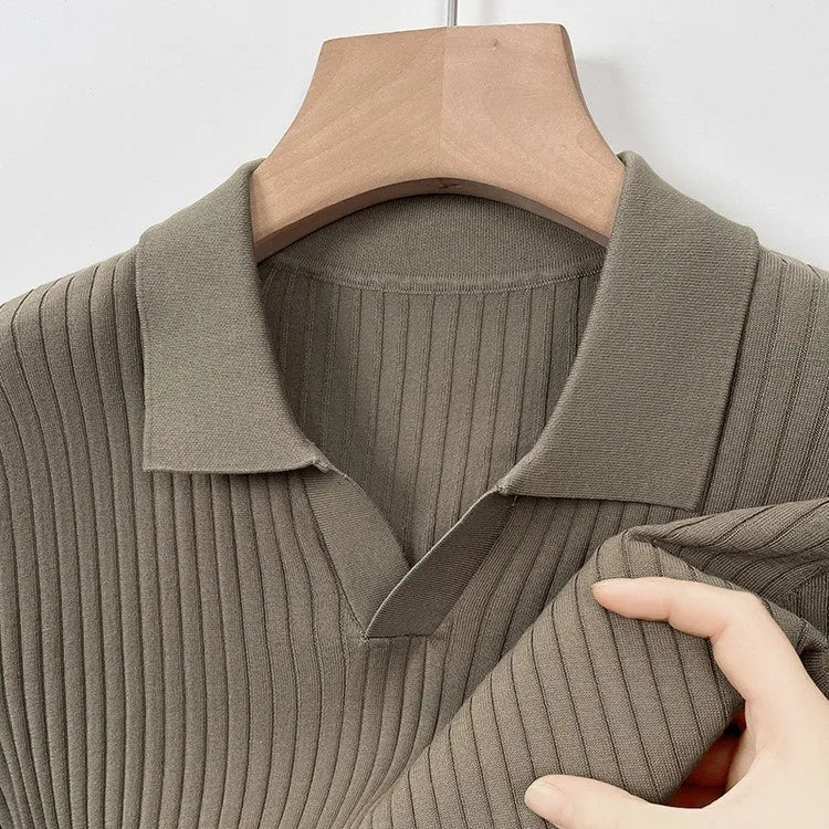 Man wearing a striped mulberry silk T-shirt with a lapel neckline and short sleeves.