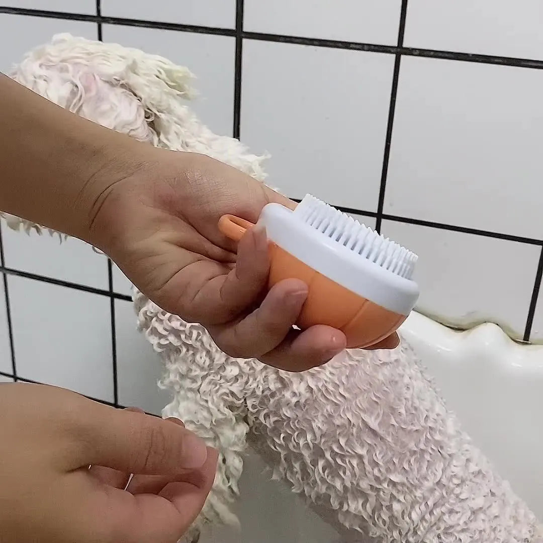 Orange TPR dog bath brush with shampoo dispenser and pumpkin-shaped grip
