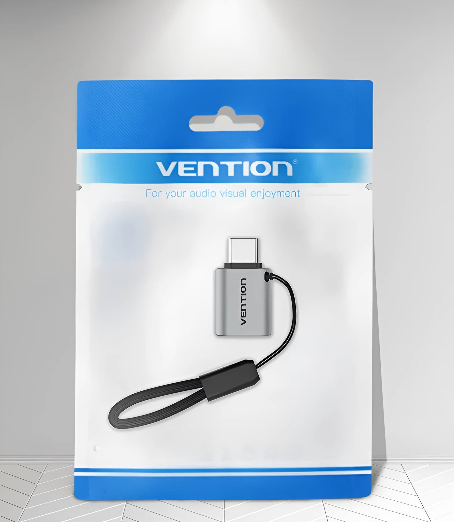 Grey aluminium alloy USB 3.0 Type-C Male to Type-A Female OTG adapter with attached lanyard.