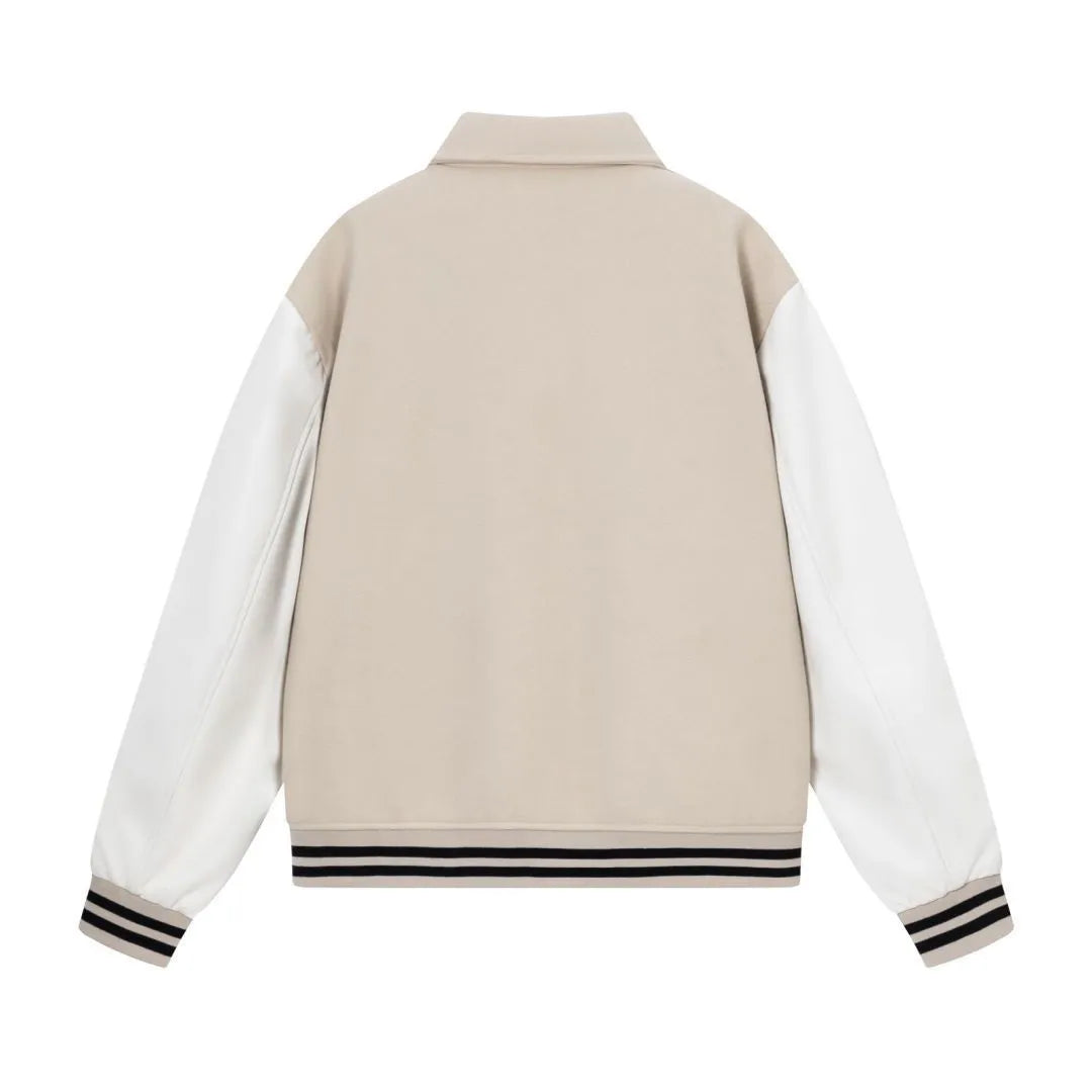 Women's apricot woollen jacket with white bone embroidery on the front.