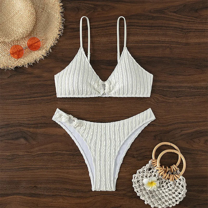 White women's swimsuit with V-neck top and matching shorts for swimming