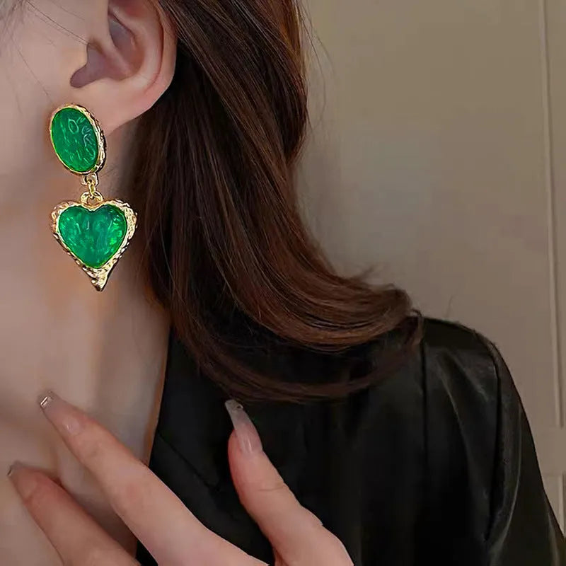Oval love heart stud earrings with pleated texture in purple, red, green, and yellow-white colour options