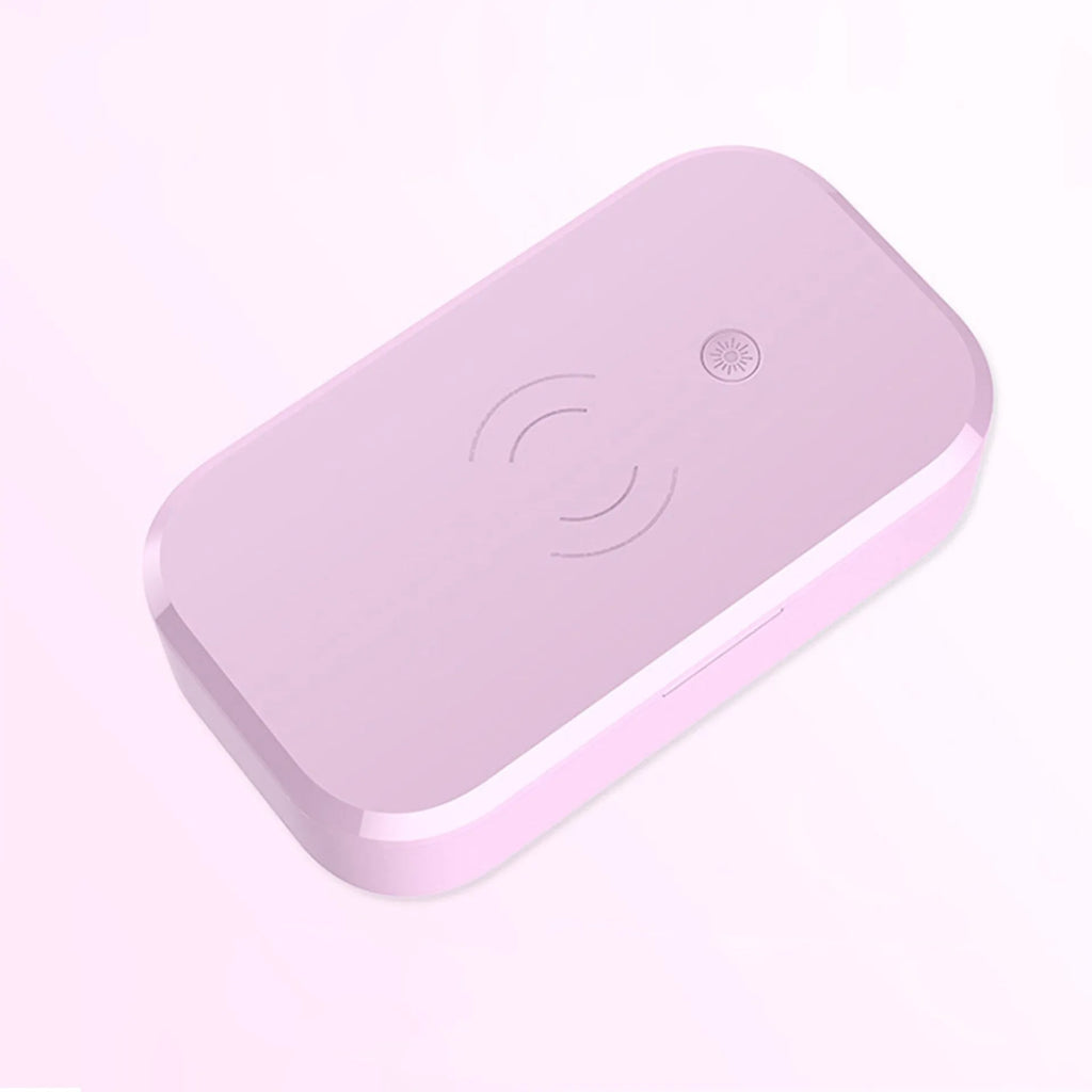 White ultraviolet disinfection box with wireless phone charging pad for nail and beauty tools.