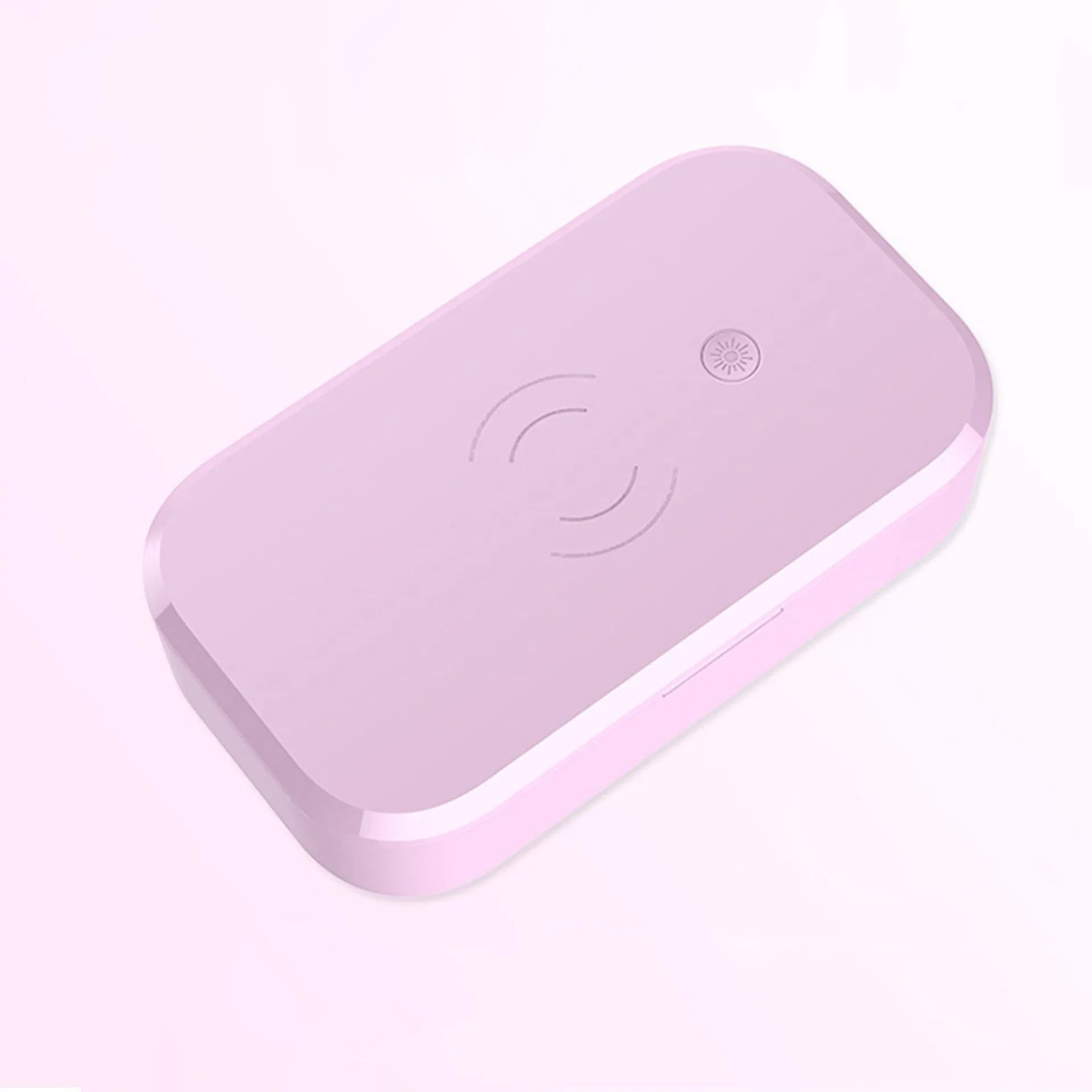 White ultraviolet disinfection box with wireless phone charging pad for nail and beauty tools.