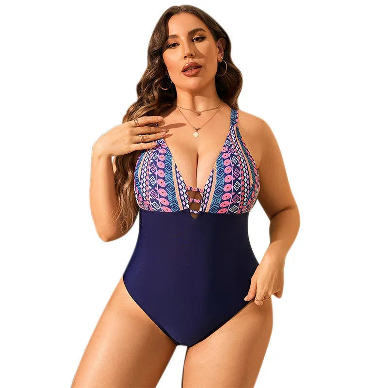 Plus size women's leopard print one-piece swimsuit with V-neck and conservative cut.
