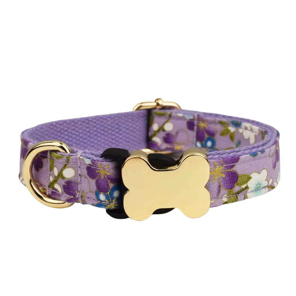 Flat nylon dog collar with grid print and a white plastic bone-shaped quick-release buckle.