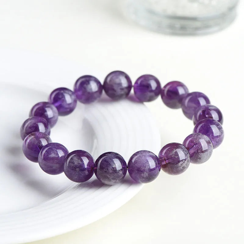 Natural feather amethyst crystal bracelet with scattered Snow Mountain purple beads and geometric Ruyi design.