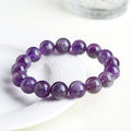 Natural feather amethyst crystal bracelet with scattered Snow Mountain purple beads and geometric Ruyi design.