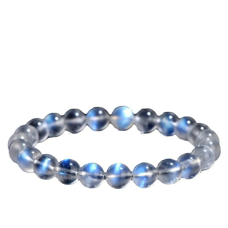 Blue Moonlight quartz bracelet with natural cream body beads on a white background.