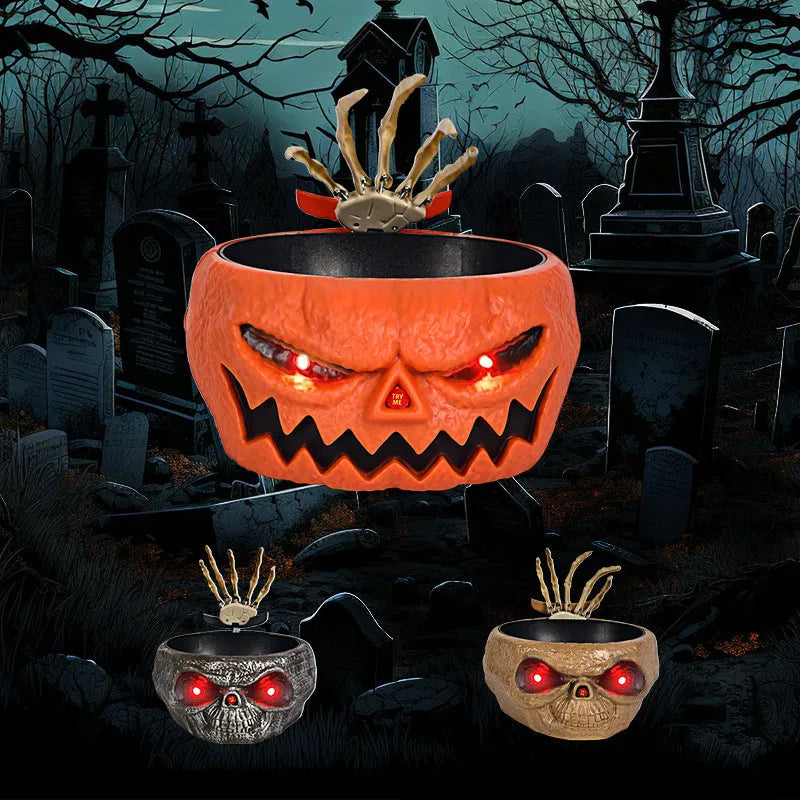 Plastic Halloween pumpkin candy bowl with motion-activated skeleton hand and lighted red eyes