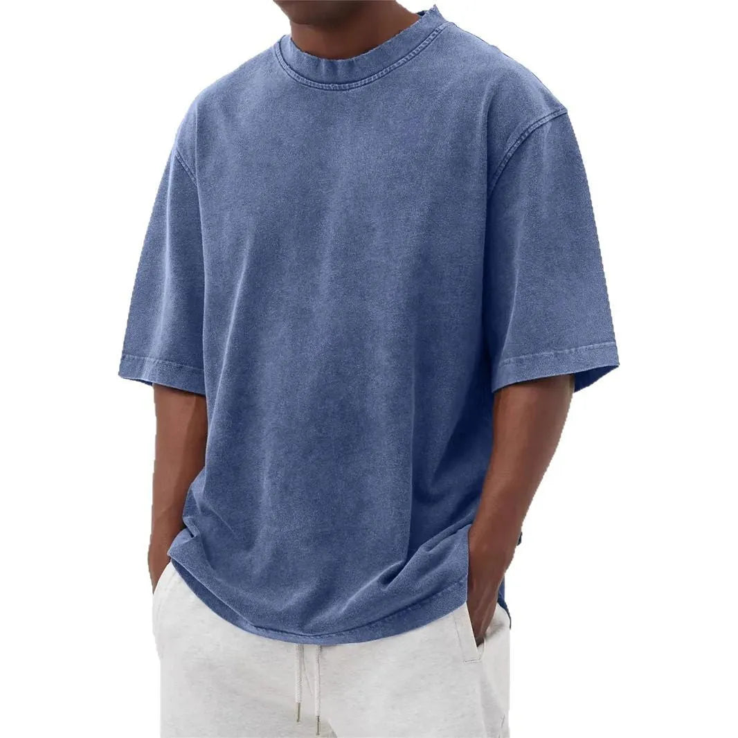 Men's stone washed loose fit t-shirt in a distressed solid colour, shown in Army Green.