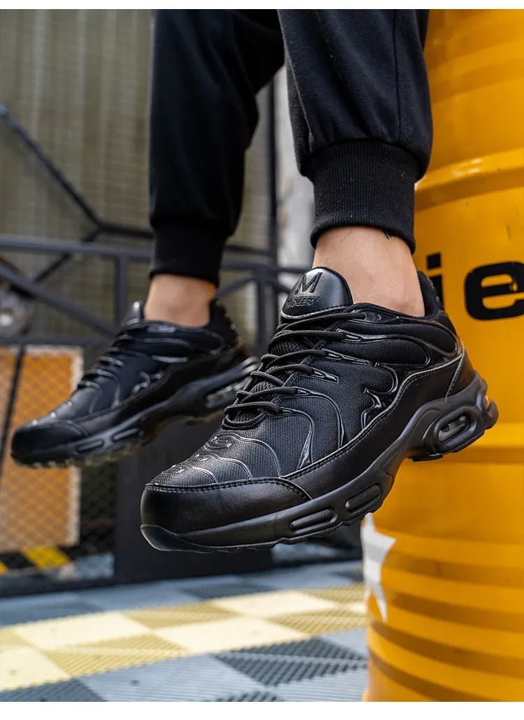 Black leather low-top safety sneakers with non-slip outsole, anti-smash and anti-scratch protection, available in sizes 41-47.