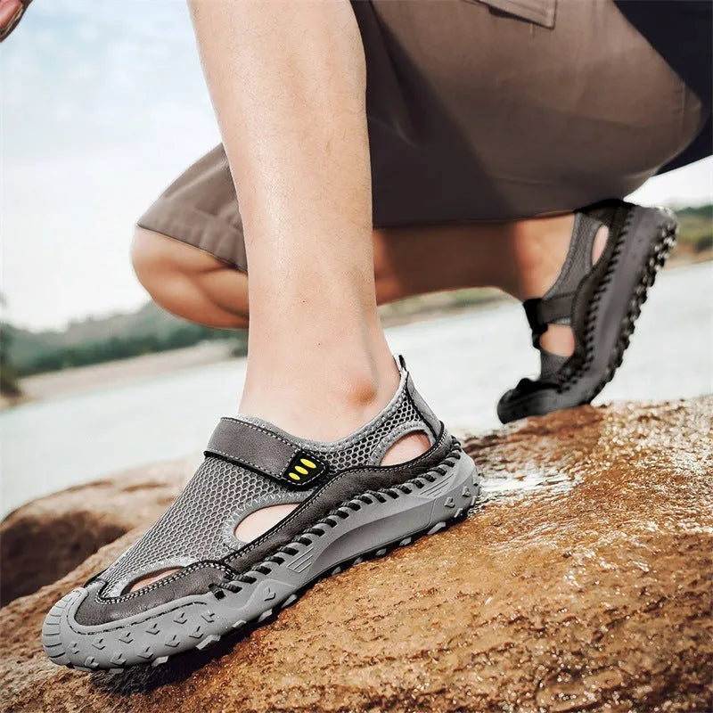 Men's black mesh sandal with Velcro strap on a rubber sole