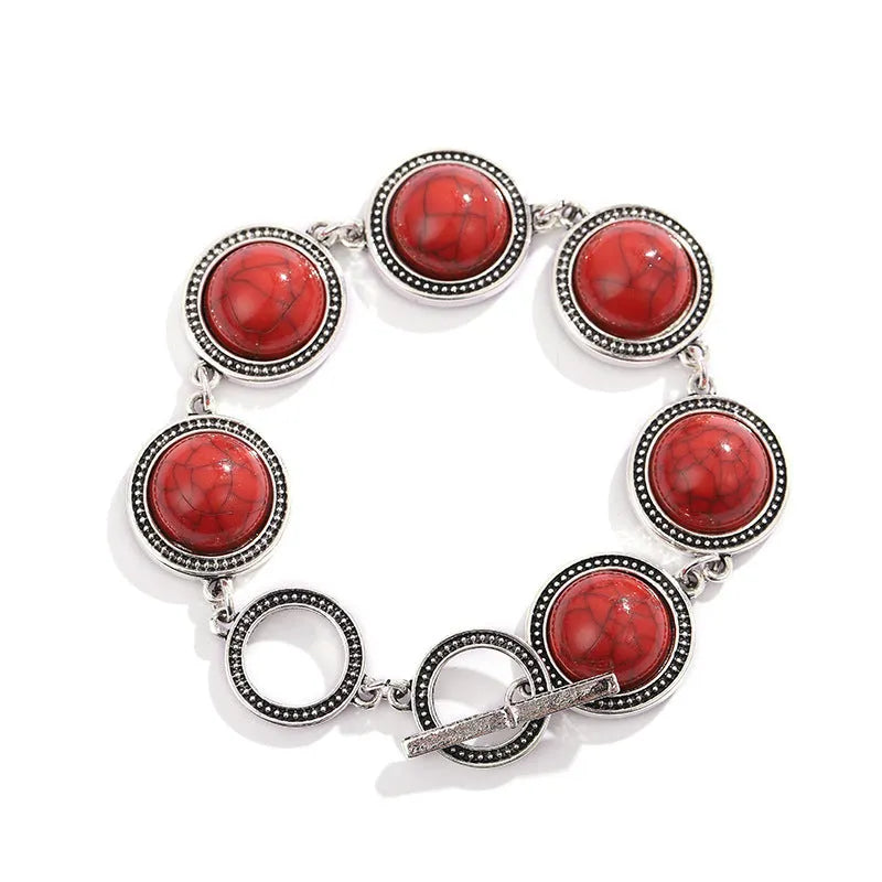 Ethnic style turquoise bracelet with ancient silver finish on wrist, green colour option