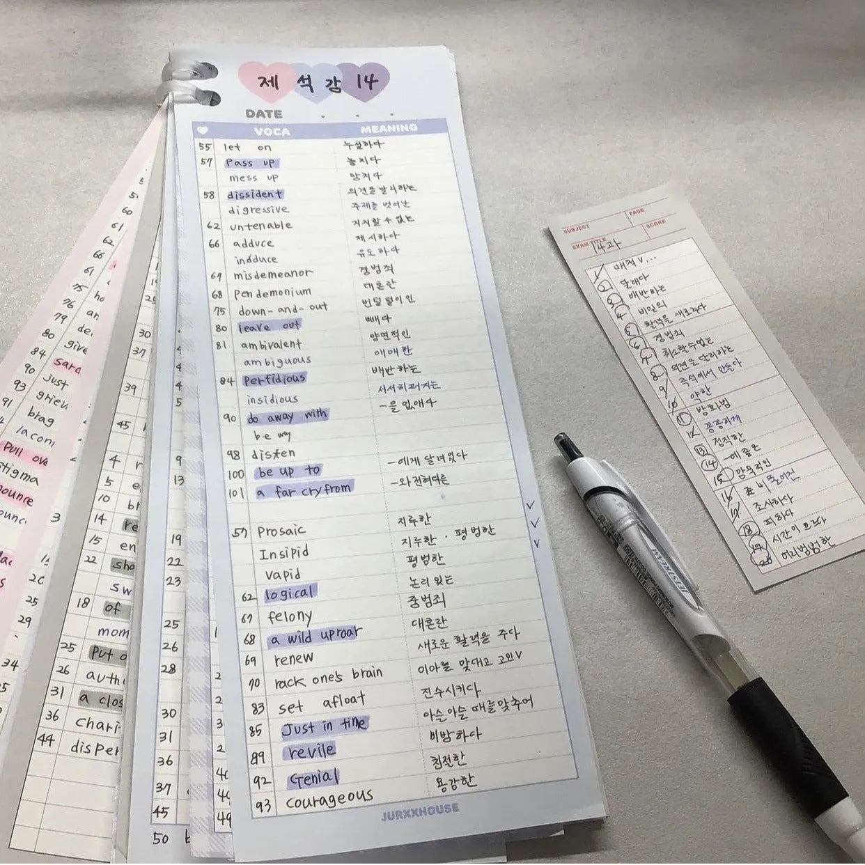 Vertical half-B5 notepad with English words, shown in pink, purple, and blue cover colour options.