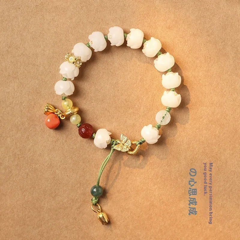 White jade Bodhi bracelet with lotus and pumpkin beads on open rope with ring clasp