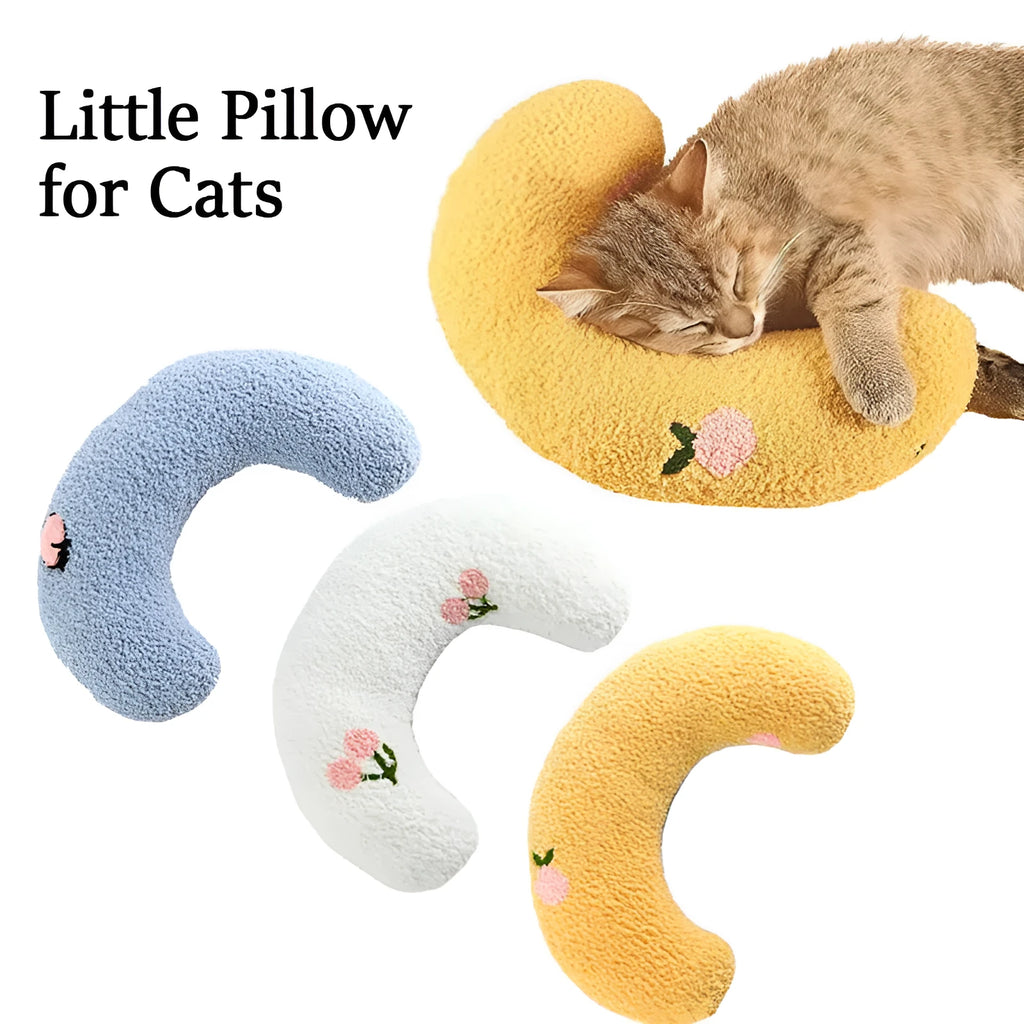 Small U-shaped plush pet pillow in blue for cats and small dogs on a white background.