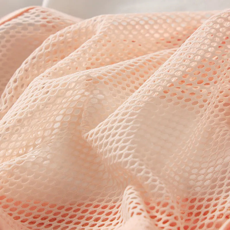 Men's low-waist solid colour briefs in high elastic mesh fabric, shown in multiple colours.