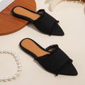 Women's denim flat slippers with tassel trim and leather lining in assorted colours.