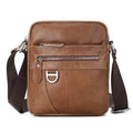 Black leather messenger bag with crossbody strap and visible sewing lines