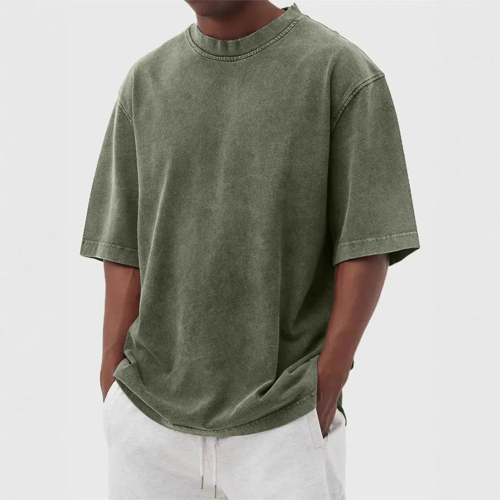Men's stone washed loose fit t-shirt in a distressed solid colour, shown in Army Green.