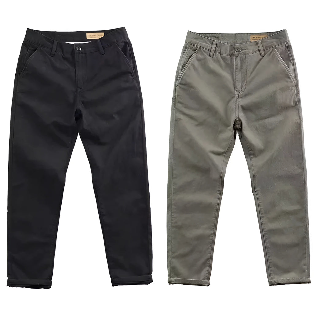 Man wearing slim-fit washed casual trousers in a neutral colour, showcasing the straight-leg style.