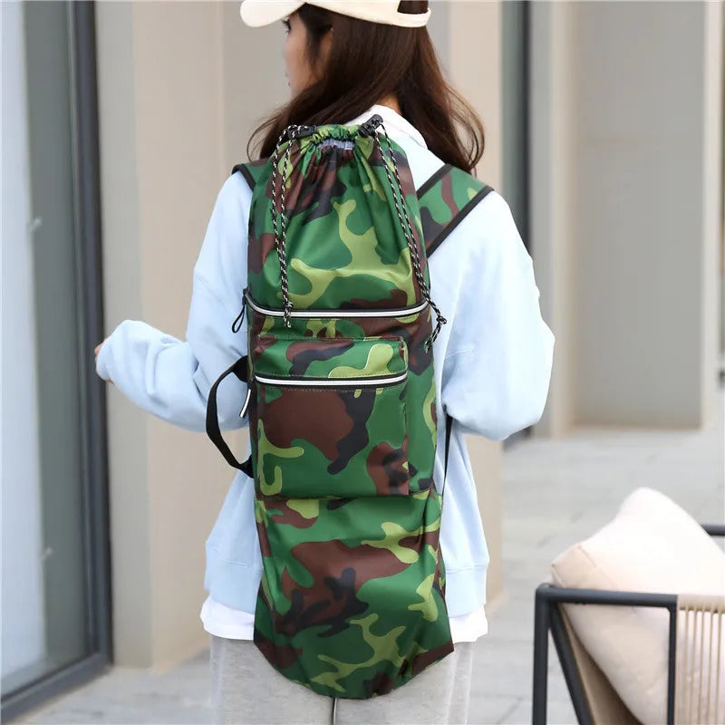 Black waterproof nylon bag for carrying a skateboard and fishing rods on a shoulder strap.
