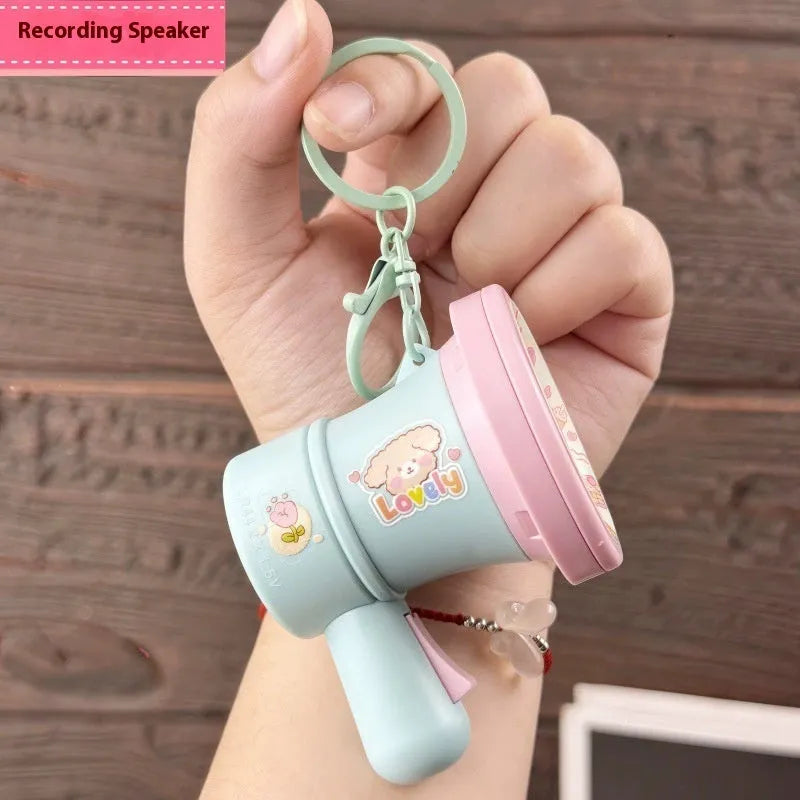 Green and yellow plastic cartoon horn keychain ornament with cute style design