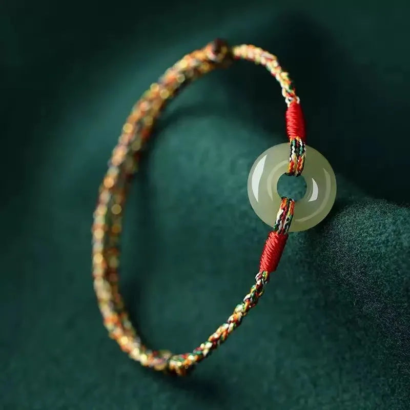 Handmade colourful rope bracelet with peace buckle on woven braided design