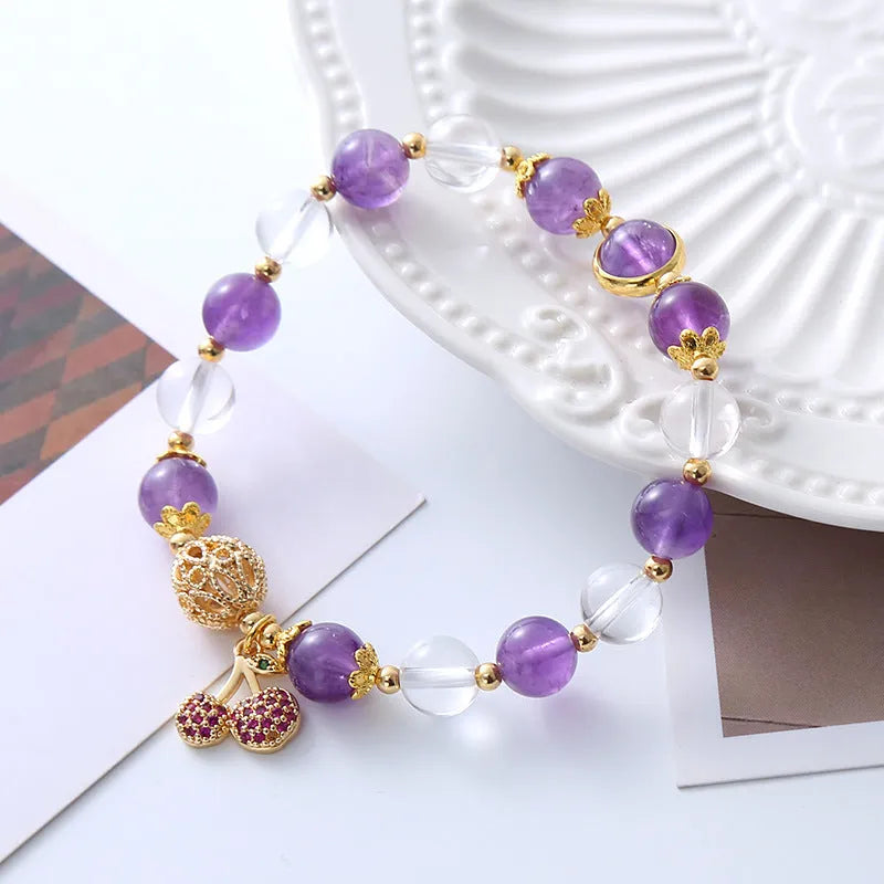 Handmade women's purple crystal bracelet with a micro-inlaid cherry flower charm.