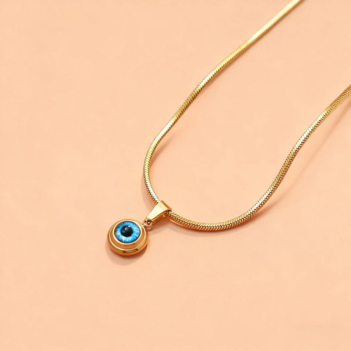 Angel Eyes titanium steel necklace with gold-plated eye pendant on 45.5cm snake bone chain