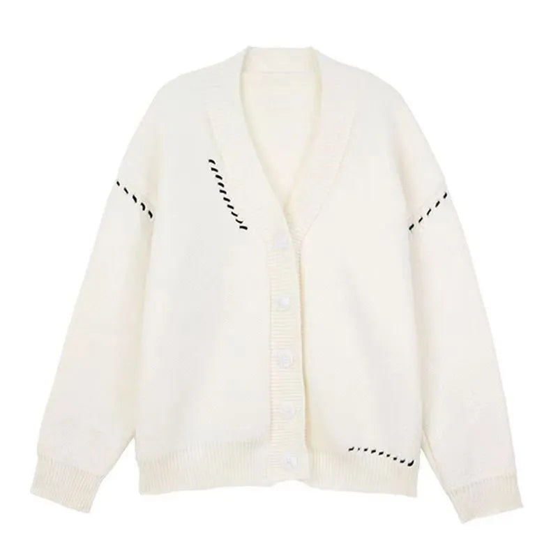 Women's loose black knitted cardigan coat with long sleeves on a hanger.