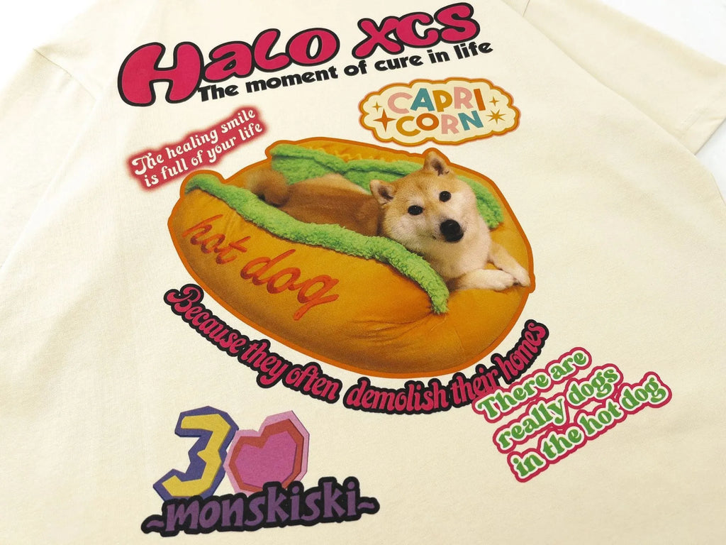 White loose cotton t-shirt with a cartoon print of a hamburger and a dog on the front.