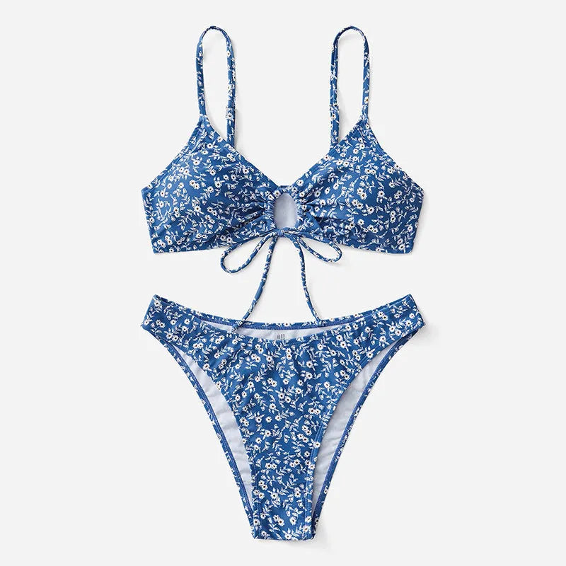 Blue polyester three-piece swimsuit set for women, featuring a halter top and boy short bottoms.