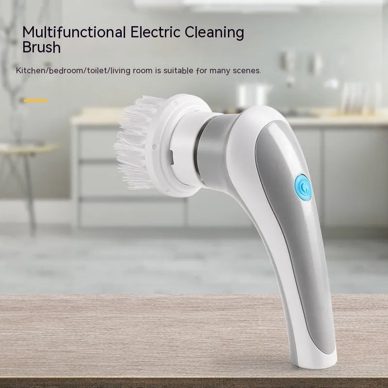 White cordless electric cleaning brush with multiple brush heads on charging dock