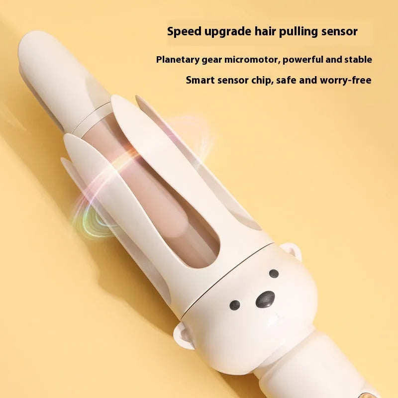 Beige anion automatic hair curler with hair stick on a white background.