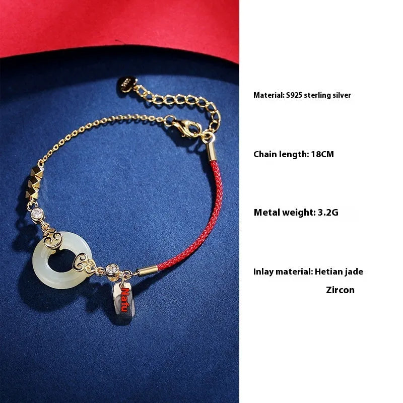 Women's Chinese style Hetian jade and sterling silver jewellery set showing bracelet, necklace, and earrings.