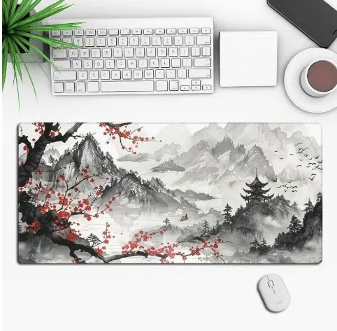 Large black anime-themed gaming mouse pad with non-slip rubber base on a wooden desk.