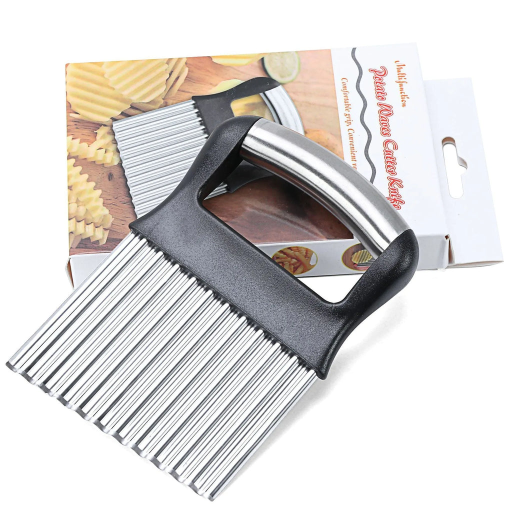 Stainless steel potato wave knife for making crinkle-cut chips on a wooden board