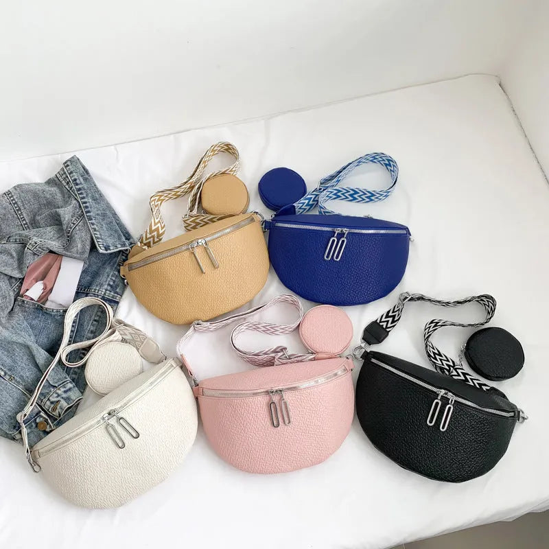 Women's solid colour PU crossbody bag with clamshell design and single shoulder strap.