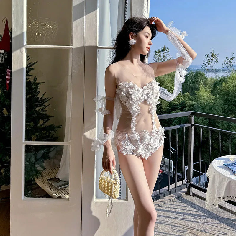 White see-through lace embroidered triangle one-piece swimsuit with backless design, nylon fabric and spandex lining, sizes M L XL.