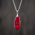 Emperor Stone jade pendant necklace on a gold chain, showing hand-carved detail and a lobster clasp.